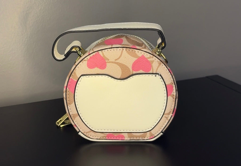 Coach Round Mini Crossbody bags. With pink heart. multiple colors. pink and red cherry.