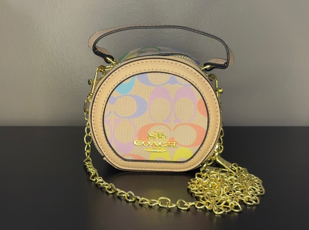 Coach Round Mini Crossbody bags. With pink heart. multiple colors. pink and red cherry.