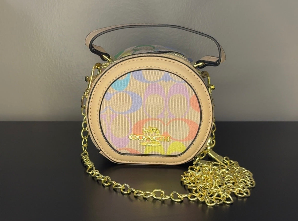 Coach Round Mini Crossbody bags. With pink heart. multiple colors. pink and red cherry.