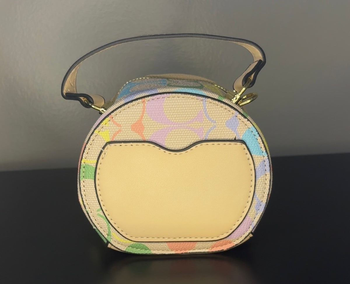 Coach Round Mini Crossbody bags. With pink heart. multiple colors. pink and red cherry.