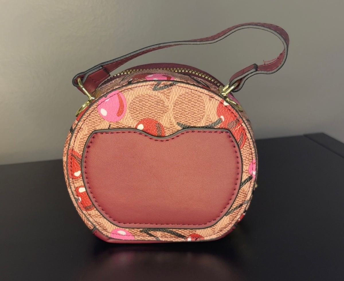 Coach Round Mini Crossbody bags. With pink heart. multiple colors. pink and red cherry.