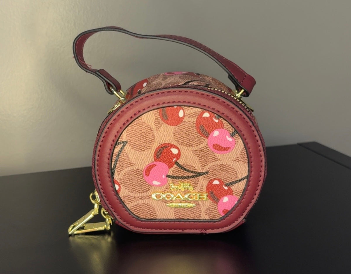 Coach Round Mini Crossbody bags. With pink heart. multiple colors. pink and red cherry.