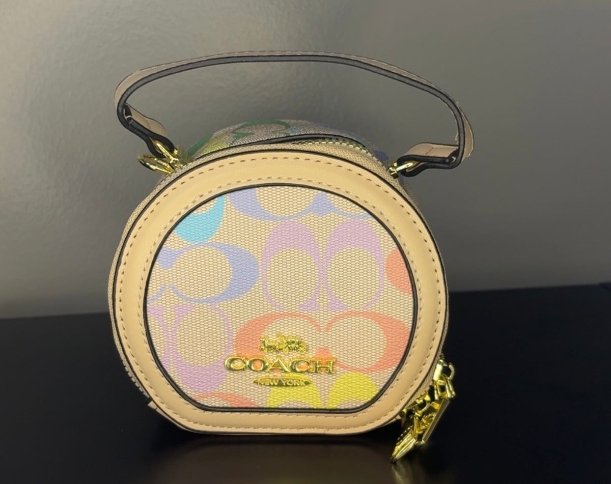 Coach Round Mini Crossbody bags. With pink heart. multiple colors. pink and red cherry.