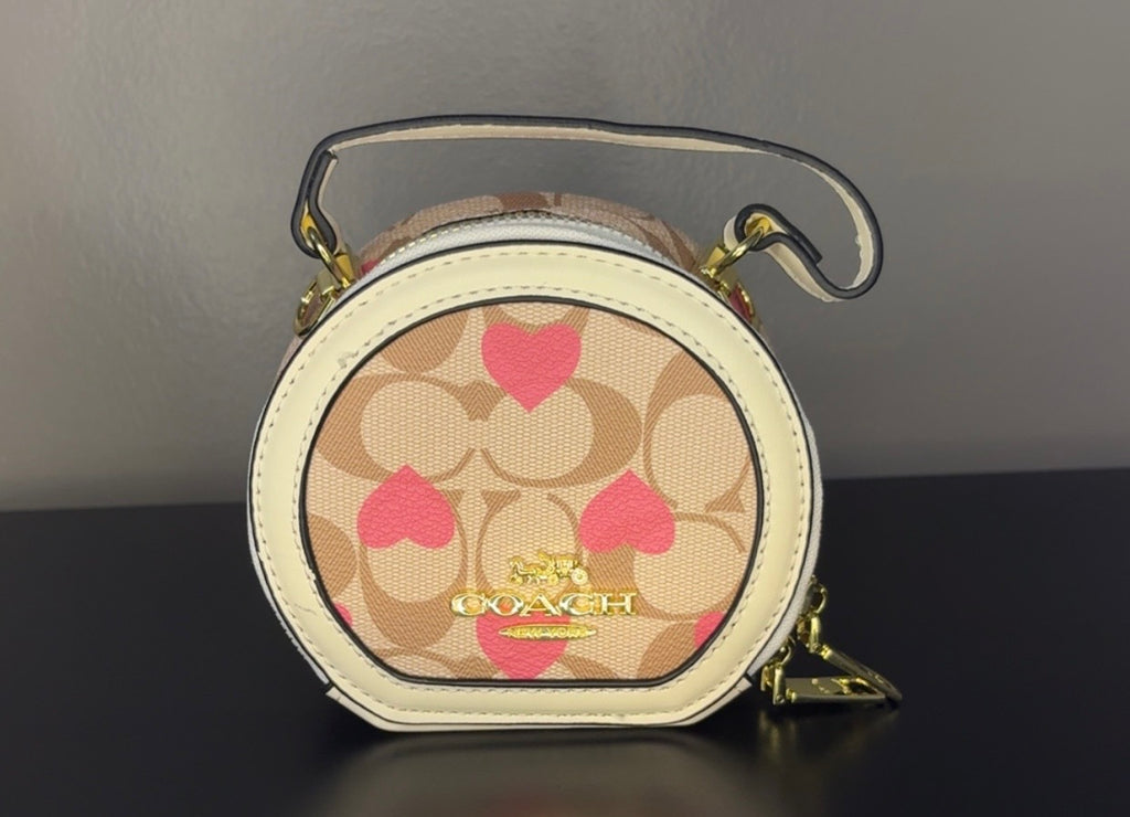 Coach Round Mini Crossbody bags. With pink heart. multiple colors. pink and red cherry.