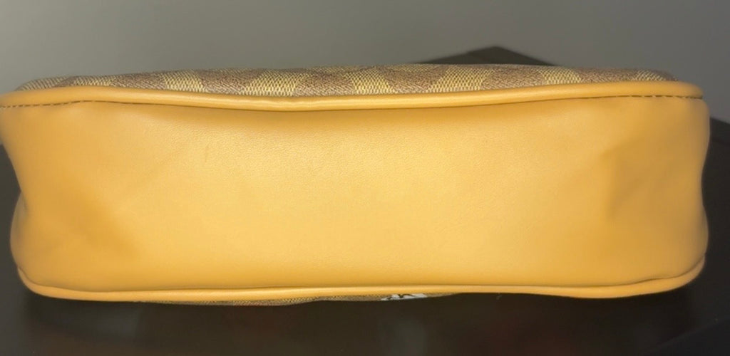 Coach crossbody bag with signature brown canvas.