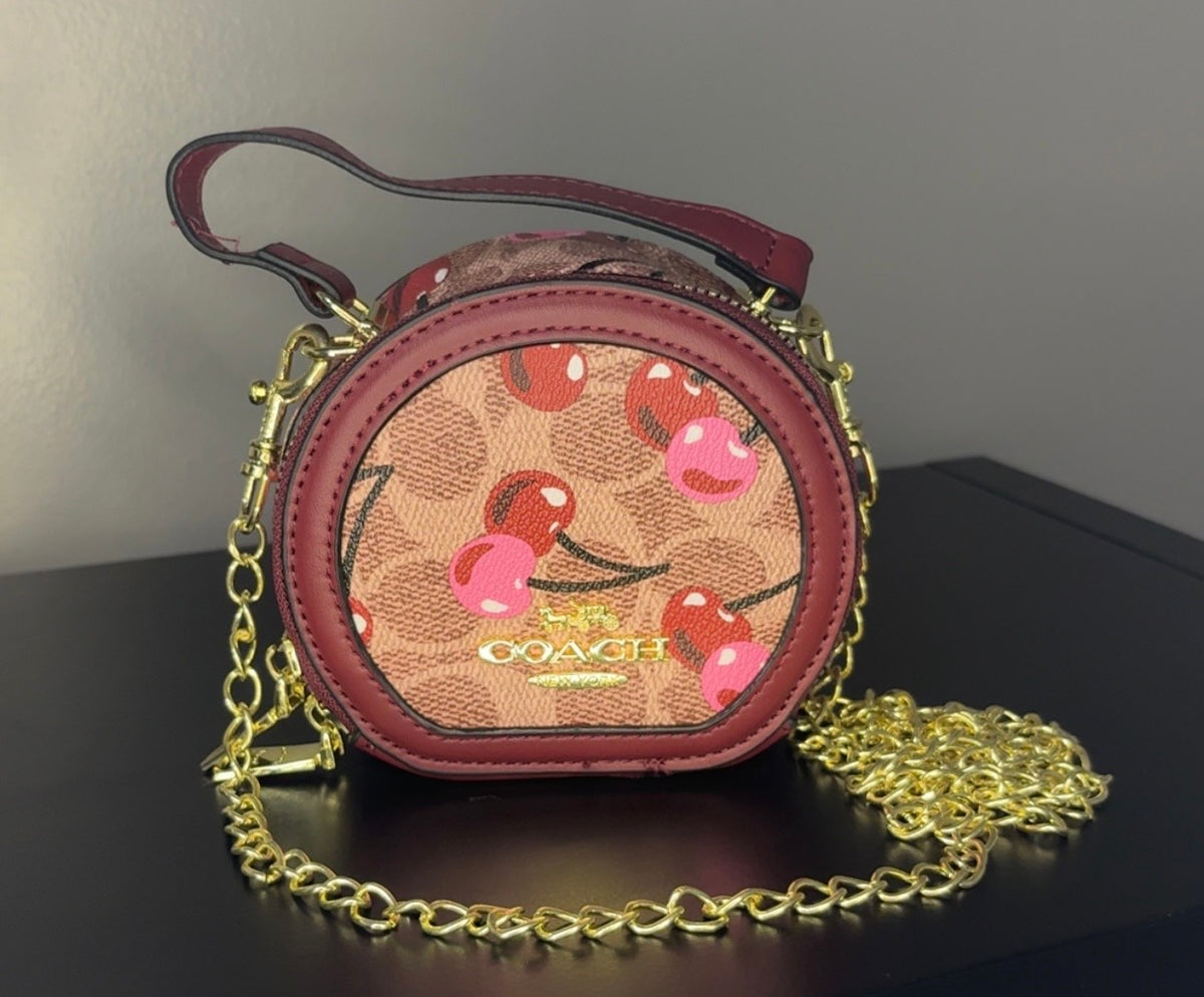 Coach Round Mini Crossbody bags. With pink heart. multiple colors. pink and red cherry.