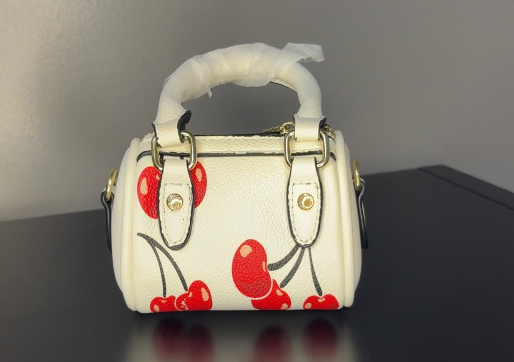 Coach mini handbag with gold chains.
