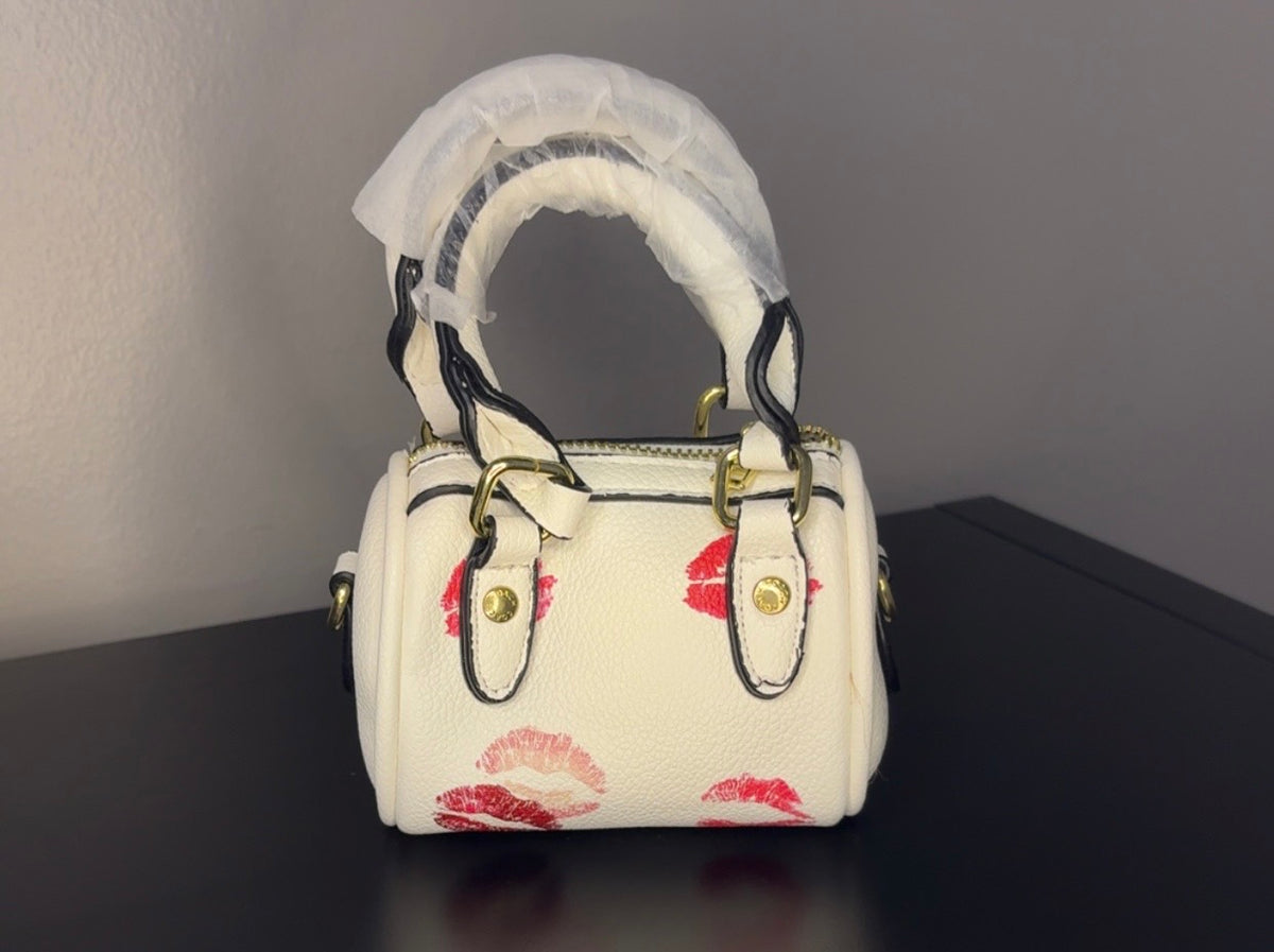 Coach mini handbag with gold chains.